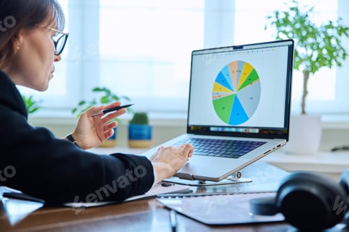 Preview: Mature serious business woman working at computer, workplace boss entrepreneur