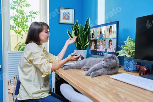 Preview: Female teacher working at home, online lesson with group of teenage students
