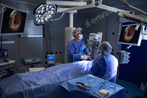 Preview: Surgeons preparing instruments during surgery in OR