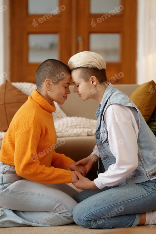 Preview: Romantic lesbian woman couple feeling love holding each other hands