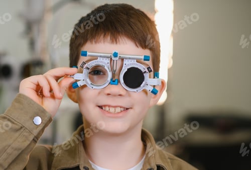 Preview: Child patient undergoing vision diagnostics with trial frame in ophthalmology clinic