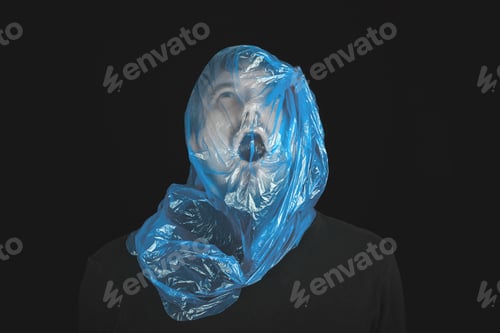 Preview: Blue garbage bag on man head. Exit bag for suicide.