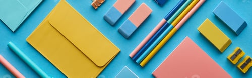 Preview: panoramic shot of envelope and arranged colorful stationery isolated on blue