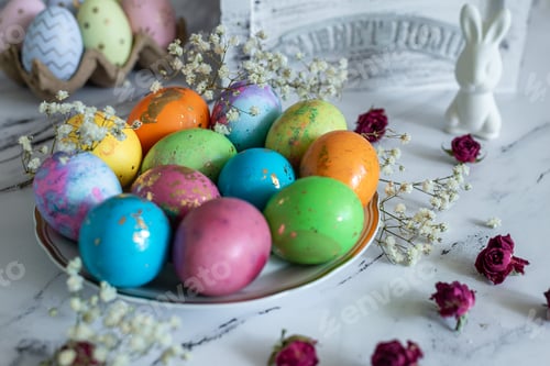 Preview: multi -colored decorated Easter eggs white Easter rabbit on a white mromoic background. Close-up