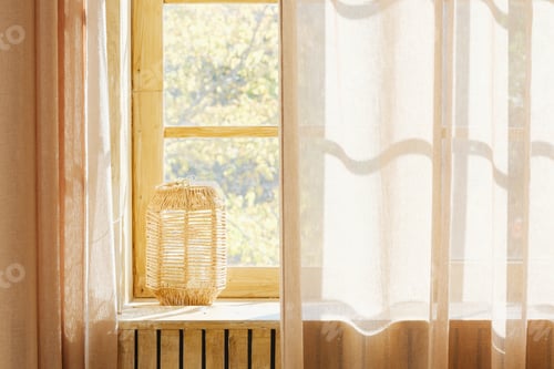 Preview: Wicker lantern on windowsill with sheer curtains and natural light