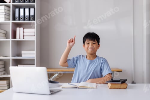 Preview: Asian student raising hand during online class at home