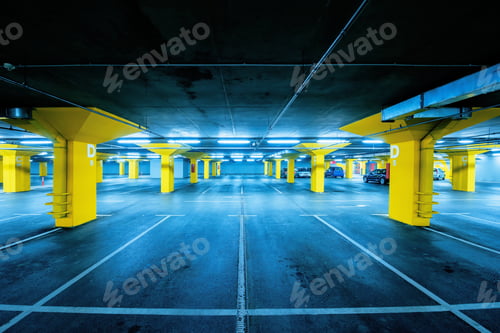 Preview: Underground garage parking lot with few cars and empty spaces