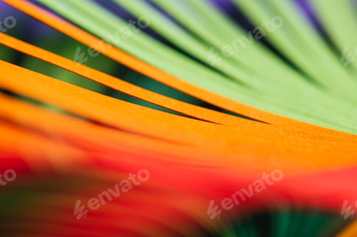 Preview: close up view of green, yellow and red quilling striped paper