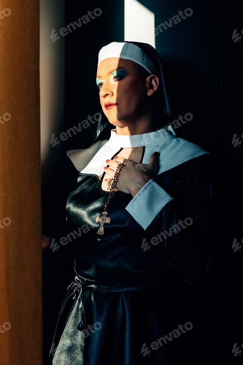 Preview: cross dressing drag queen performing a praying Catholic nun