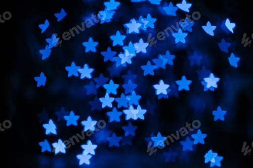 Preview: beautiful blue stars bokeh on black background