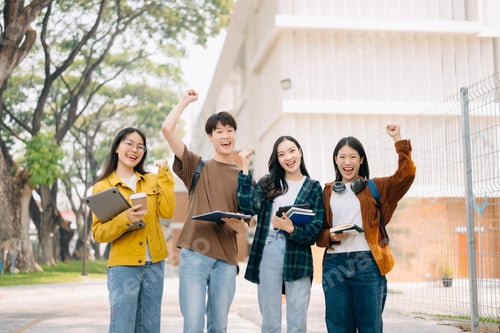 Preview: Two smart young Asian college students focusing on his school project, looking
