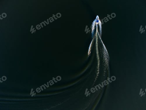 Preview: Top view of a boat sailing in the lake