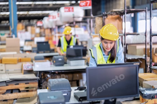 Preview: Worker working in the large depot storage warehouse concentrate check stock at cashier counter