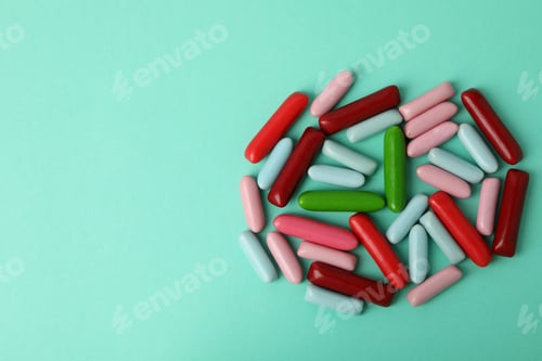 Preview: Gummy candies on mint background, space for text