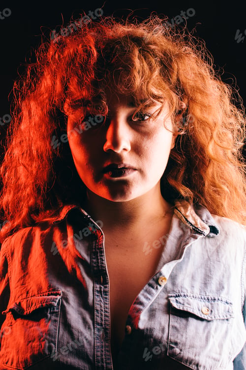 Preview: Portrait Of A Beautiful Girl With Curly Red Hair