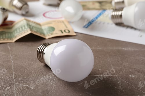 Preview: Energy saving concept on gray textured background