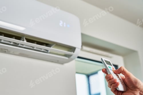 Preview: Hand adjusting temperature on air conditioner