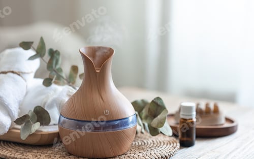 Preview: Spa composition with aroma oil diffuser lamp on a blurred background.