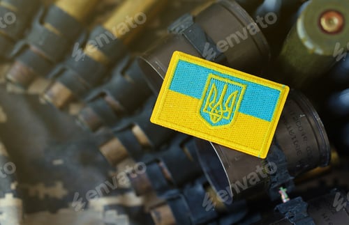 Preview: Ukrainian symbol on machine gun belt lies on ukrainian pixeled military camouflage