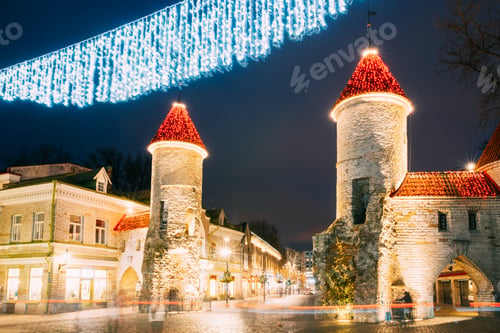 Preview: Tallinn, Estonia. Famous Landmark Viru Gate In Street Lighting At Evening Or Night Illumination