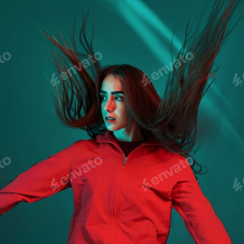 Preview: Jumping, hair is in the air. Studio shot indoors with neon light. Portrait of beautiful young girl