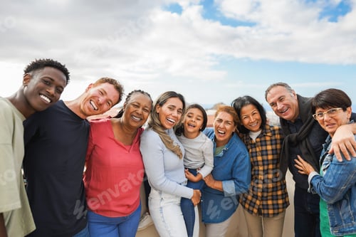 Preview: Group of multigenerational friends smiling in front of camera