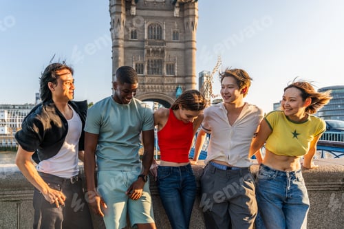 Preview: Multiracial group of happy young friends bonding in London