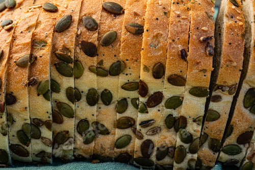 Preview: sliced loaf of pumpkin seeded bread