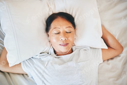 Preview: Bedroom face, music and relax woman sleeping, tired or nap for break, morning wellness or listening