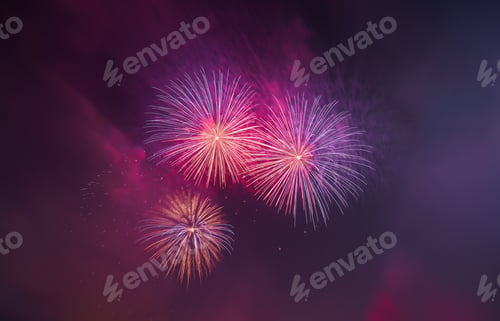 Preview: Abstract colorful beautiful fireworks salute against the blu sky. Neon Holographic pattern of salute
