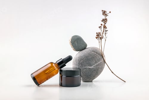 Preview: abstract composition of balancing stones, bottles for cosmetics and dried flowers