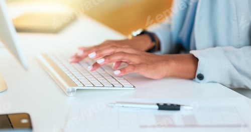 Preview: Closeup of a womans hands typing on a keyboard while sitting at a desk and sending an email in an o