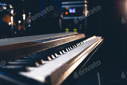 Preview: Keys of an electronic piano close-up on a dark background.
