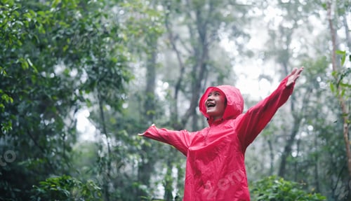 Preview: Joyful young woman breathing pure air in a lush forest