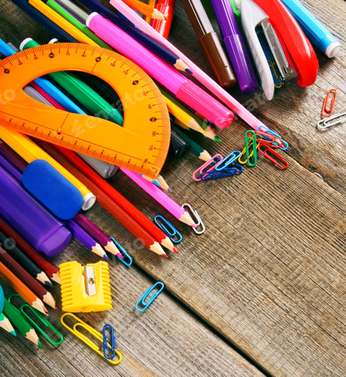 Preview: School tools. On wooden background.