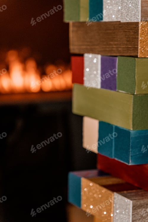 Preview: many stacked up wooden blocks with flames in the background and a fire place behind