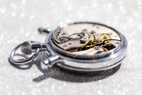 Preview: Macro Shot of Watch Gears on Glittery Background