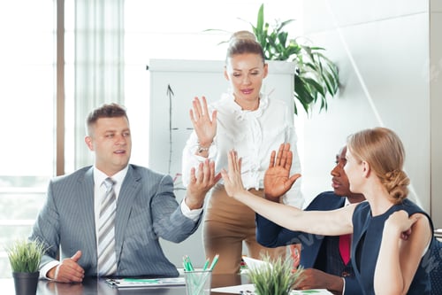 Preview: Business team in discussion at modern office during daytime meeting