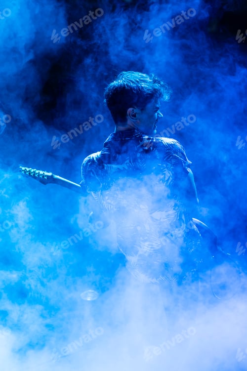 Preview: Rock and roll group performing live at night