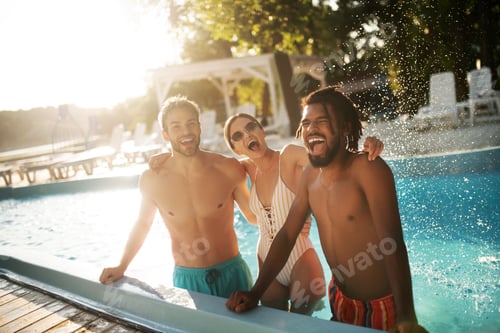 Preview: Woman hugging her best friends while having rest in pool