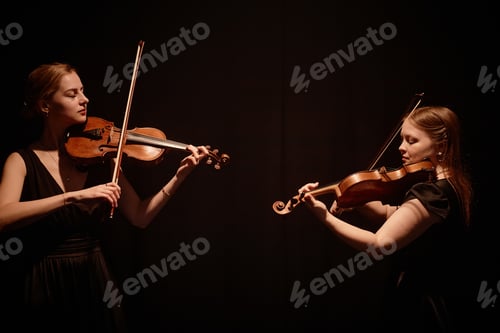 Preview: Two Violin Artists Performing Concerto on Black Background
