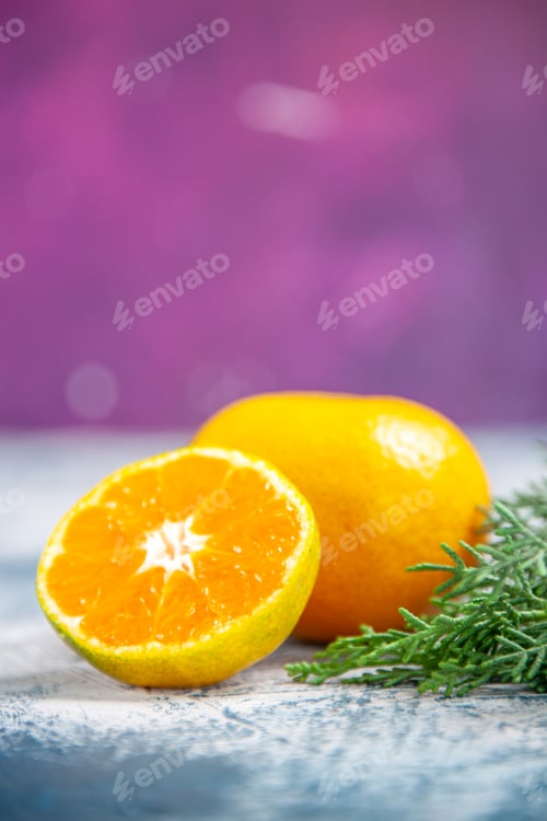 Preview: front view fresh tangerine on blue-pink background citrus juice photo fruit color