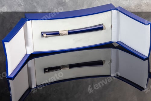 Preview: A signature fountain pen on a gray marble background. A box and case are nearby.