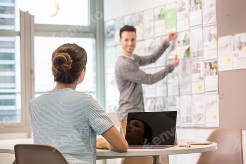 Preview: Male digital designer preparing mood board in office