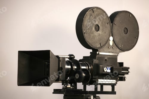 Preview: Vintage movie camera recording on white background