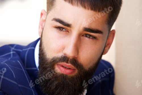 Preview: Close up serious businessman sitting alone in contemplation