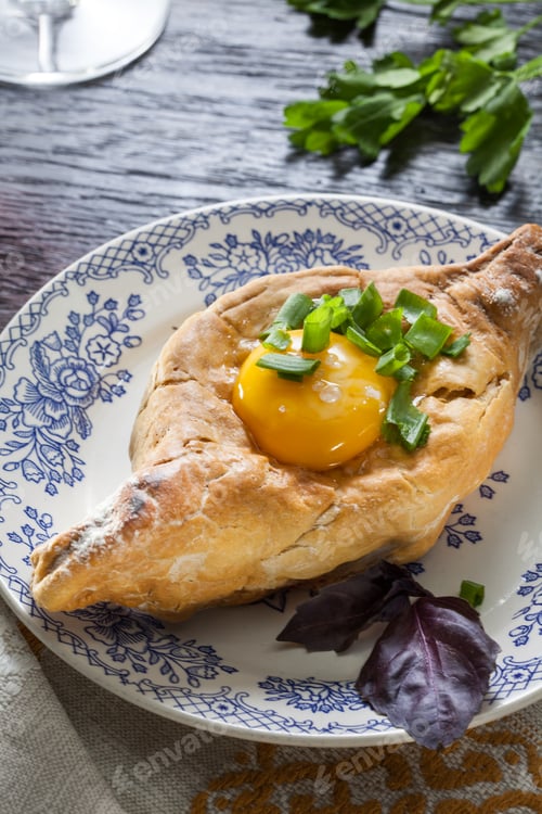 Preview: Khachapuri on plate with herbs