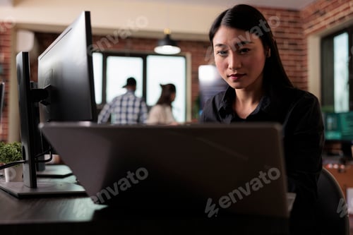 Preview: Asian software developer engineering an autonomous defence system