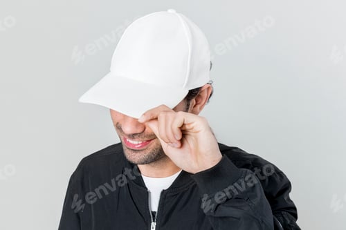Preview: Happy man wearing a white cap