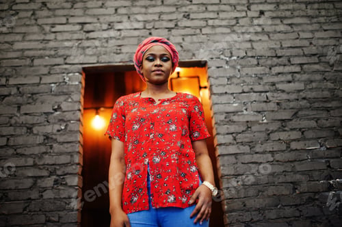 Preview: Stylish african woman in red shirt and hat